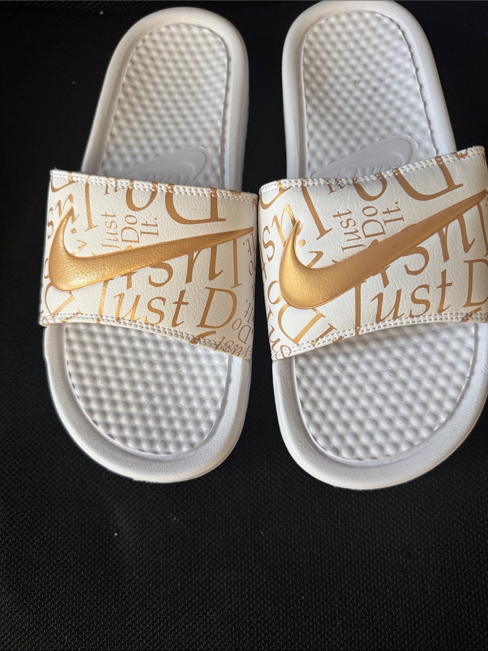 Nike Women’s White Slide Sandals with Gold Swoosh